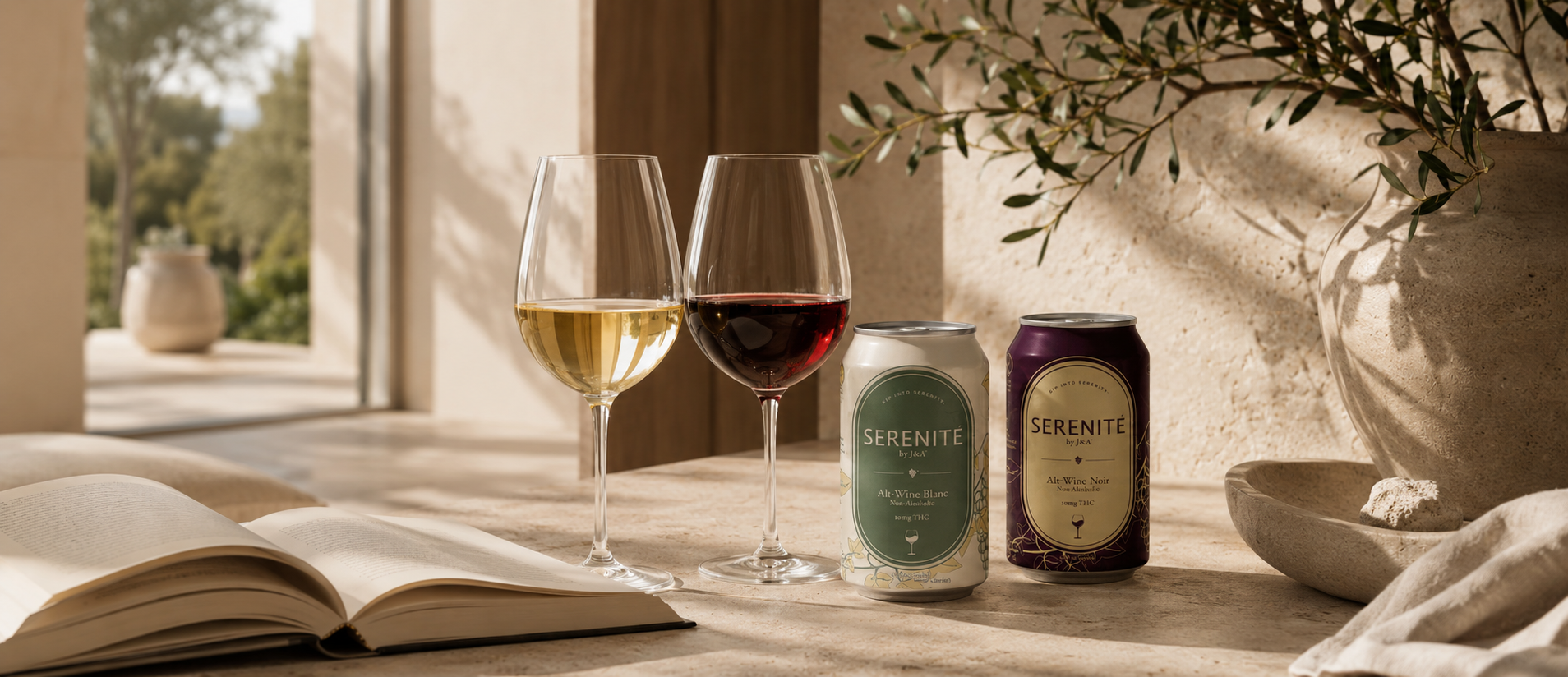 Two wine glasses with white and red wine on a table next to two bottles of 'Serenite' wine, with an open book and decorative elements in the background.